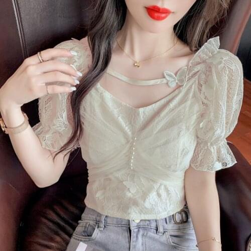 Summer short-sleeved shirt 2021 fashion new one-shoulder design niche puff sleeve short shirt solid color casual top women