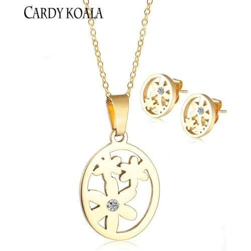 Korean version of the round brand hollow flower titanium steel creative design pendant necklace earring set gold-plated children