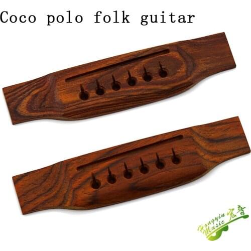 Coco folk guitar under the code of universal code under the code of the bridge to pull the string board of the instrument a