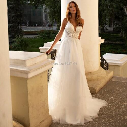 Popular V Neck Beading Spaghetti Straps Wedding Dresses Champagne Lace Appliques A Line Open Back Floor Length Bridal Gowns