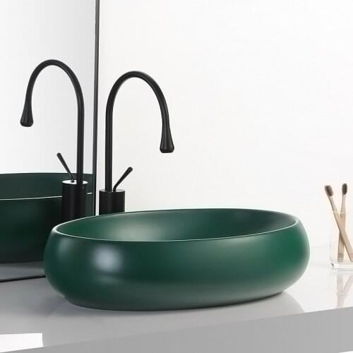 Tabletop basin northern Europe creative dark green hotel ceramic wash basin oval household toilet light luxury tabletop