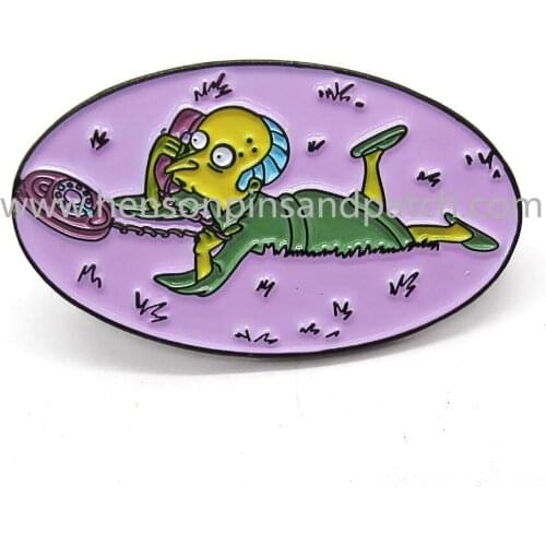 Customized iron black metal soft enamel yellow man pin badge