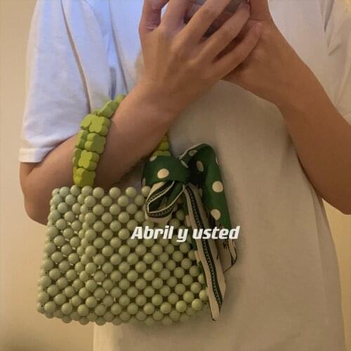 Fashion handbag womens bag mobile phone bag pearl lipstick sundry bag Beaded pure hand woven handbag summer wrist bag