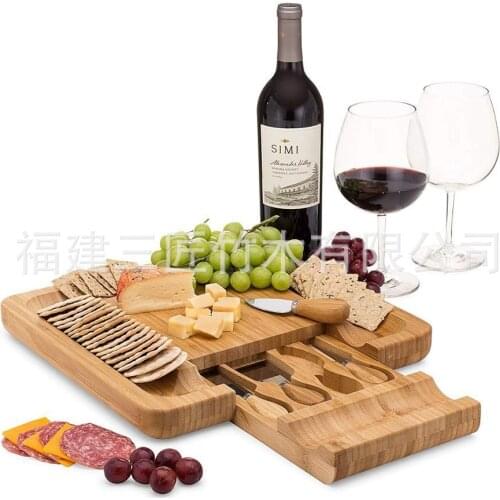 Bamboo wood cheese board with four cheese knife and fork cutting board serving cutting plate