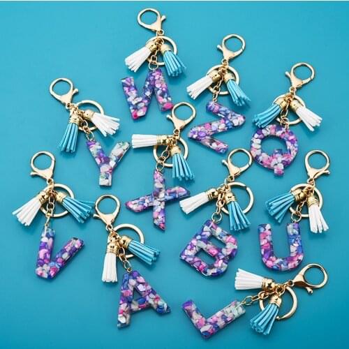 1pcs Women Keychains 26 Glitter Hollowed-out Words Handbag Tassel English Letter Keyring with Puffer Ball Charms