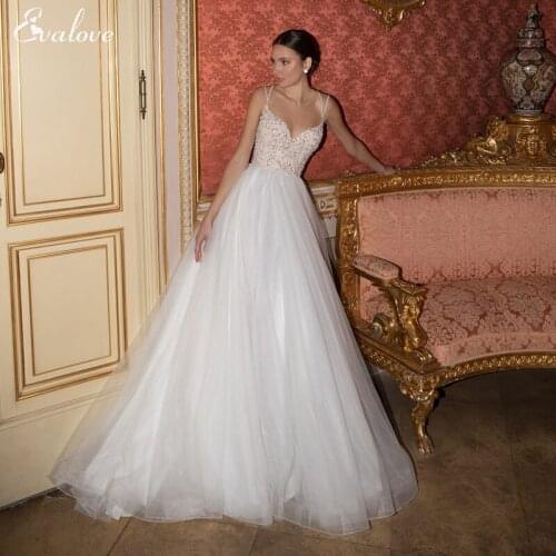 EVALOVE Sexy Sweetheart Neck Backless Brush Train A-Line Wedding Dress 2021 Luxury Beading Spaghetti Straps Princess Bridal Gown