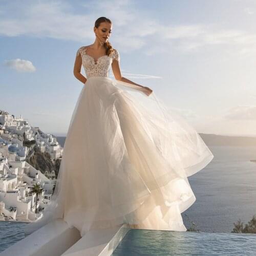 Charming Summer Beach Lace Cap Sleeves Bridal Wedding Dresses Sweetheart Wedding Gowns for Bride Back Out Beading Chapel Train