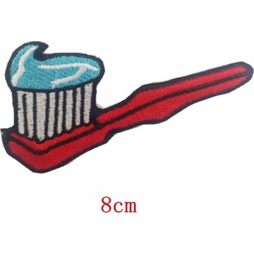 A red toothbrush with toothpaste Embroidered iron on patch