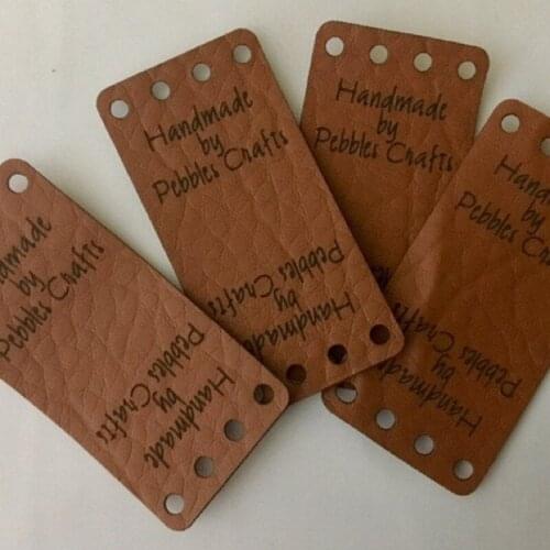 Custom labels, center fold labels, faux leather labels, faux leather tags, folding tags, knitting leather label