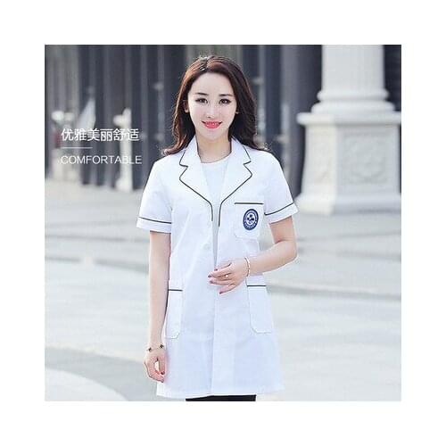Doctor in white coat and nurse in female short-sleeved beauty salon cosmetologists skin overalls made to order