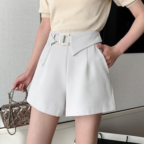 Womens 2021 spring and summer new and trendy asymmetric metal button shorts, high waist and wide legs