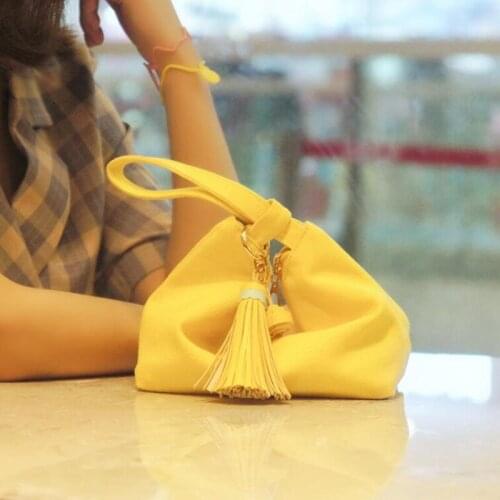 New canvas wrist handbag ladies wild tassel bag tassel mobile phone bag solid color hand-carry wonton bag