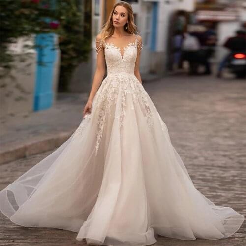Princess Wedding Dresses 2021 Beading Spaghetti Straps A-Line Appliques Sweep Train Tulle Bridal Gown Sleeveless Backless