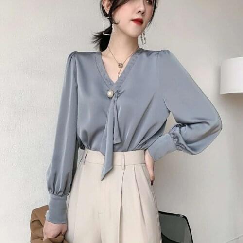 RUGOD 2021 spring new lace-up shirt womens satin long-sleeved pearl buckle versatile temperament drape Korean gentle wind top