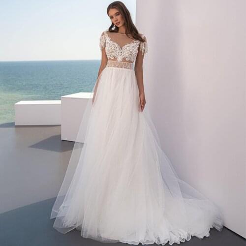 Eightree Sexy Boho Wedding Dresses White Lace Tassel Beach Hollow Out Backless Bride Dress Short Sleeve Weeding Gowns Plus Size