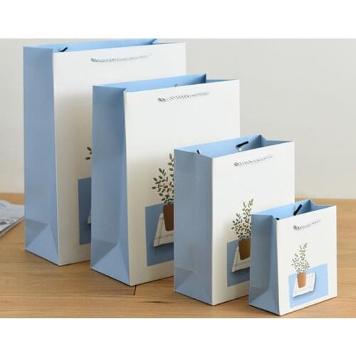 China custom embossed logo luxury gift paper bags with ribbon handling retail store shopping --XP2282