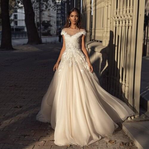 O-neck Champagne Wedding Dresses Cap Sleeves Cross Tulle Lace Appliques Open Back Formal Bridal gowns Robe de Mariee 2021