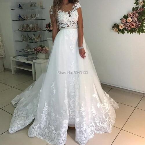 Unique Lace Appliques Mermaid Wedding Dresses with Detachable Skirt 2020 Jewel Neckline Cap SLeeves Buttons Back Bridal Gowns