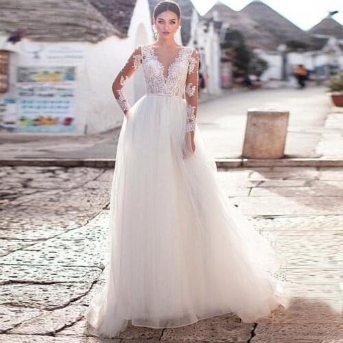 Elegant Illusion O-Neck Long Sleeve Wedding Dresses A-Line Tulle Gowns Appliques See Through Back Bridal Dresses Floor Length