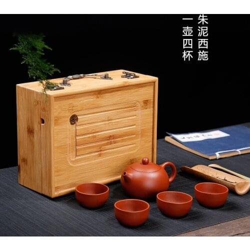 Yixing purple clay teapots suit manufacturer mud zhu xi shi pot a pot of four cups all hand gift set custom logo