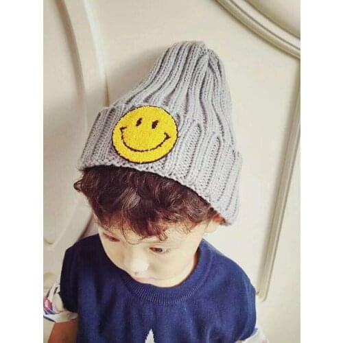 New cute smiling face childrens wool hats, mens and womens children knitted hats warm and cold ear protection hats wholesale