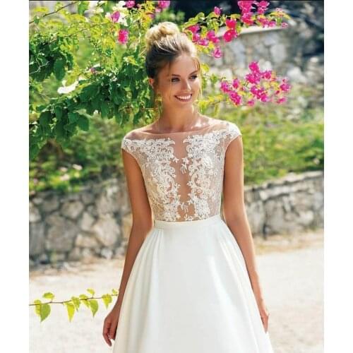 2020 Scoop Lace Applique A Line Wedding Dresses Sleeveless Tulle Boho Bridal Gowns Long Train Elegant Princess Dresses