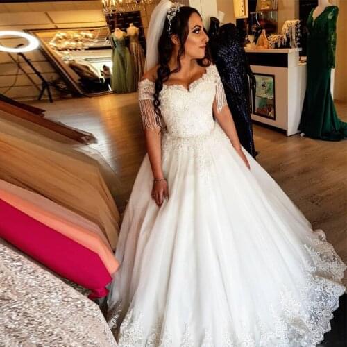 Luxury Beading Wedding Gown Off the Shoulder Tassel Ball Gown Lace Appliques Pearls Wedding Dresses Arabic Dubai Bridal Gowns