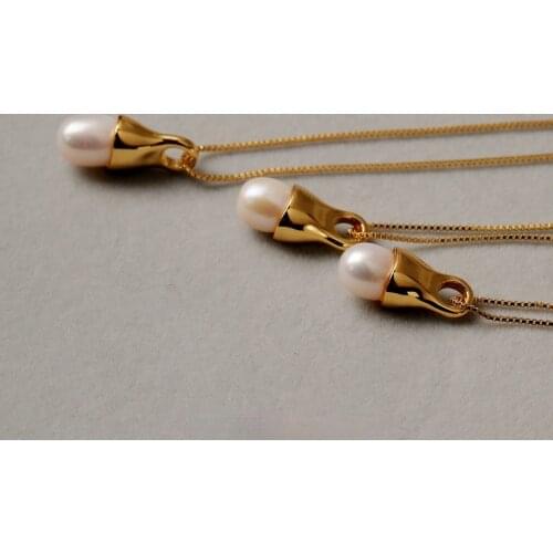 A pearl brass simple texture polished Necklace Pendant with high color retention