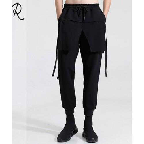 Personalized three-dimensional cut and stitching fake two slim feet nine-point trousers for men