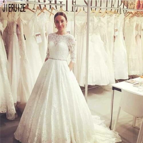JIERUIZE Latest Lace Wedding Dresses O Neck Half Sleeves Button Back Crystal Sashes Bridal Gowns Beach A Line Vestido De Noiva