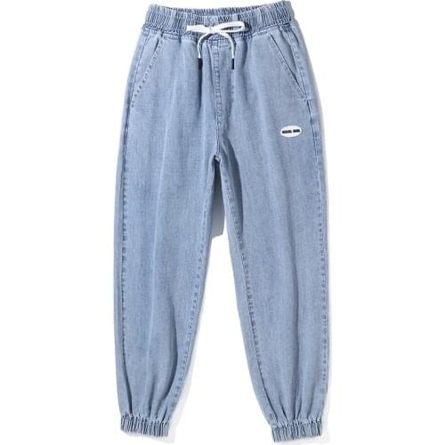 New Young Mens Loose Casual Harem Light Blue Jeans Solid Color Large Size Lace-up Trousers Fashion Trend Cropped Trousers