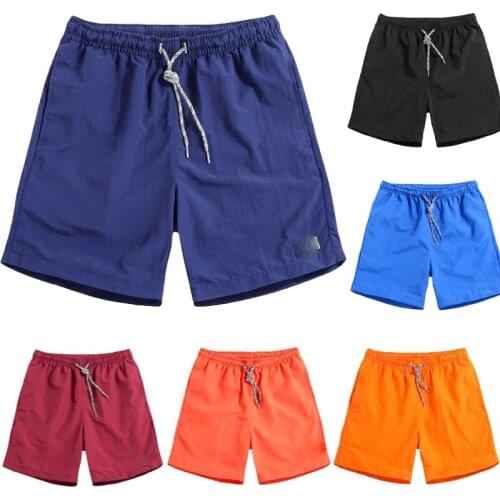 Solid color quick-drying shorts mens fashion trend casual three-point sports pants home outdoor elastic beach pants large size