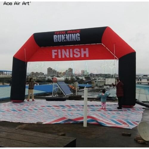 Giant black and red inflatable running arch with removable start and finish line banner for sport event