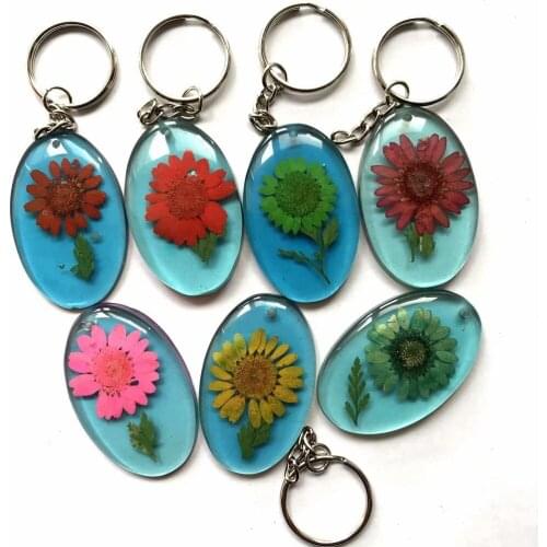 YQTDMY 12 pcs charming blue bottom mixed sun flower style vogue keychain