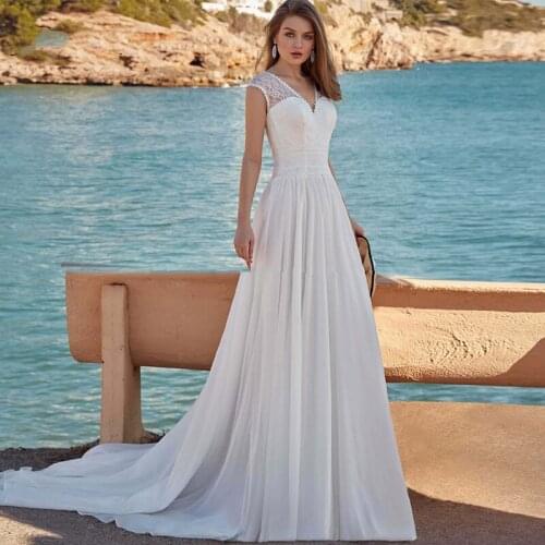 Hot Sale Beach Wedding Dresses 2021 Lace Wedding Gowns Cap Sleeves V Neckline Back Out Boho Bridal Dresses Summer White On Sale