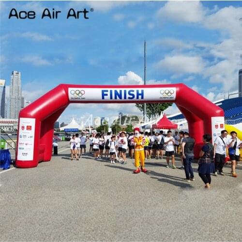 Customize giant red 4 legs inflatable start and finish arch with banner for race event