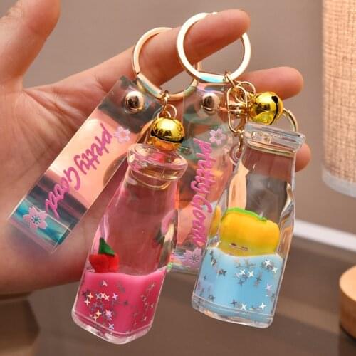 Cartoon Creative Fruit Into The Oil Milk Bottle Keychain Cute Fashion Doll Charm Charm Keychain Couple Mobile Phone Fun Keychain