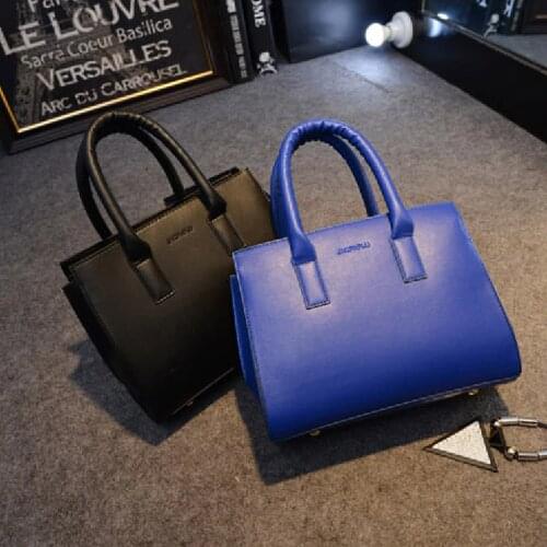 2015 fashion handbag shoulder bag hand bag lady shaping Europe and the big color killer package