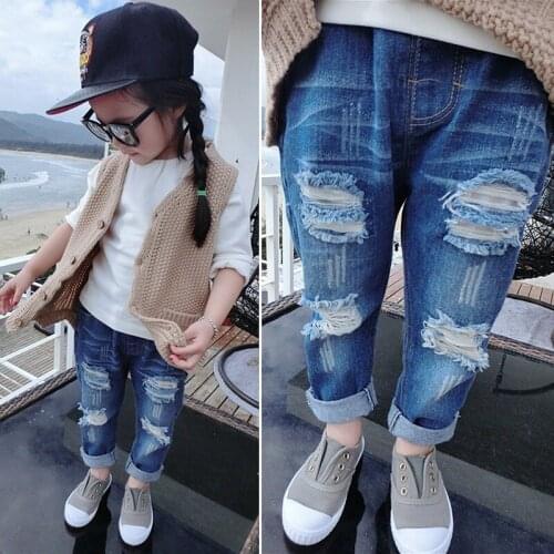 2021 spring new childrens fashion personalized pierced Jeans Girls Sweet solid tassel scratch slim pants pants