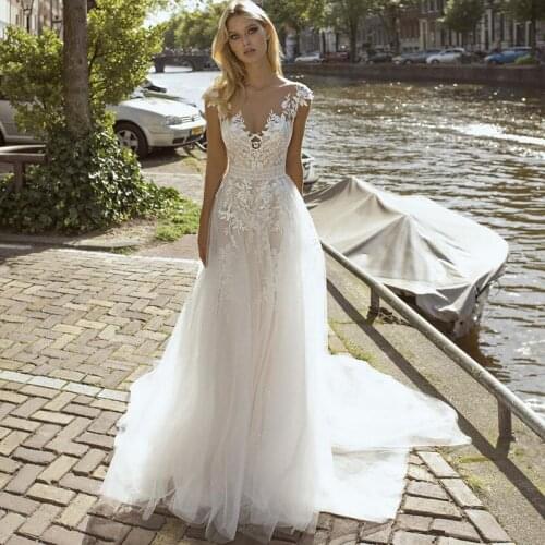 Vintage Cap Sleeve Lace Bride Dresses 2021 A Line Appliqués Tulle Prom Party Gown Wedding Dresses Robes De Mariage