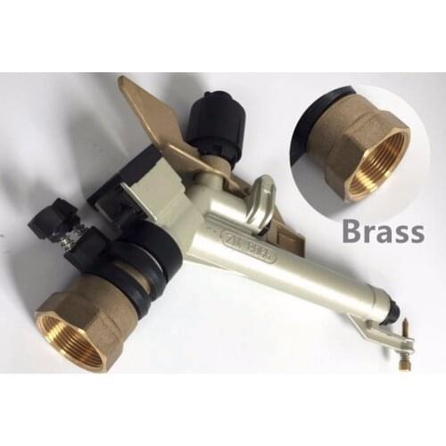 Rain Gun Irrigation System. Irrigation System Watering Cornfield. Agricultural Sprinkler Spraying Corn field on a Farm