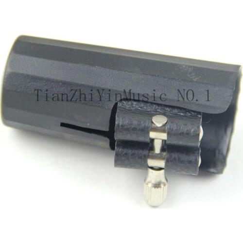 Ligature and cap for clarinet and Alto Sax parts