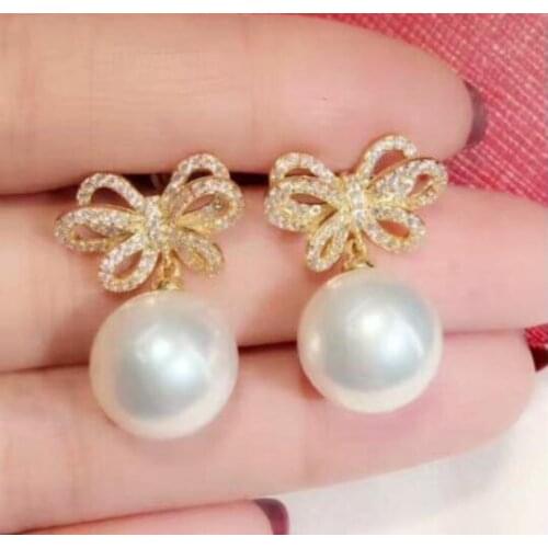 Charming pair of 10-11mm south sea round white pearl earring 925s