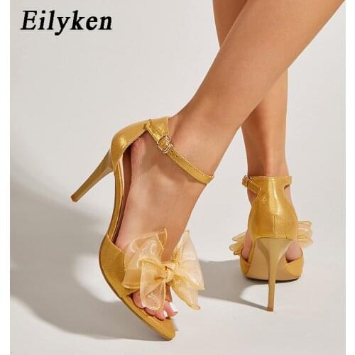 Eilyken New Elegant Flower Woman Shoes Ankle Strap Bowknot Thin High Heels Sandals Sexy Peep Toe Gold Silver Party Wedding Shoe