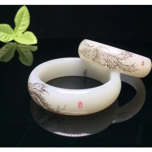 Hetian white jade carved bracelet. The texture is transparent and hand-carved.hw01