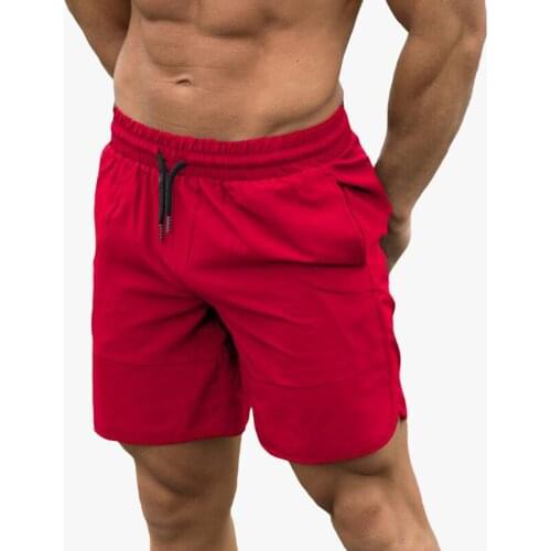 Summer gym fitness bodybuilding fashion trend mens leisure all-match body shaping solid color beach running sports shorts men