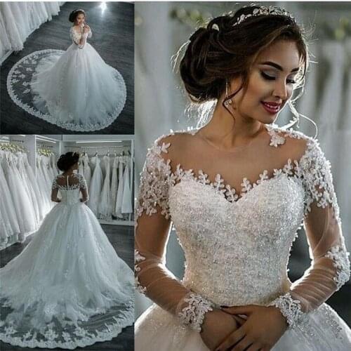 Dubai Elegant Long Sleeves Ball Gown Wedding Dresses Sheer Crew Neck Backless Lace Appliques Beaded Vestios De Novia Bridal Gown