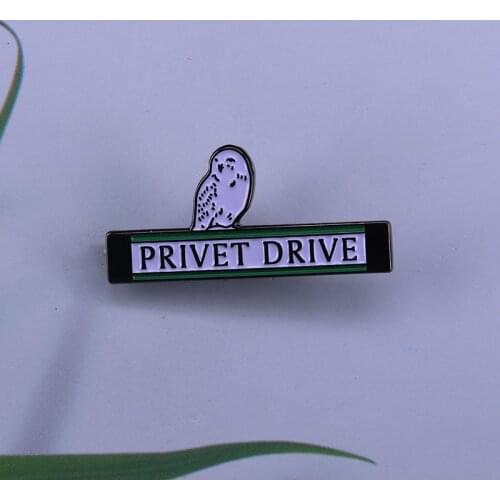 Cute Hedwig enamel pin the snowy owl perched on the Privet Drive street sign
