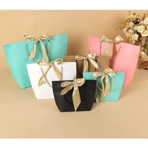 Elegant Celebration Cardboard Present Wrap Paper Gift Bag Boutique Clothes Packaging Bags with Bow Ribbon LX8555