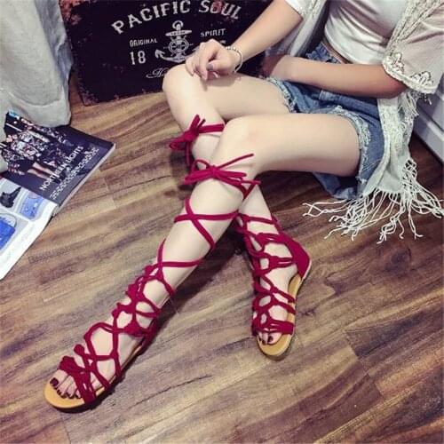 In the summer of 2019, the new flat heel Boots, womens cross bands with the Roman style of pure color peep-toe Boots
